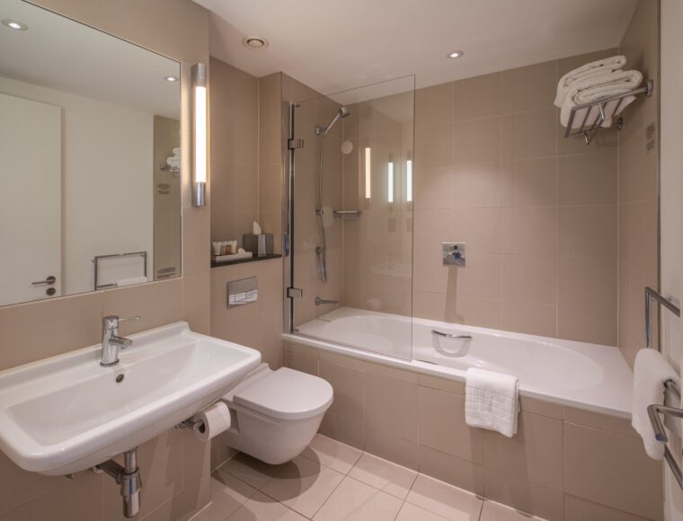 Deluxe bathroom with a built in shower and bathtub, located in Liverpool.