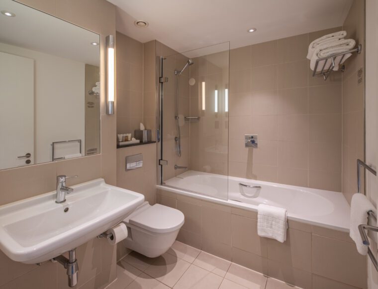 Deluxe bathroom with a built in shower and bathtub, located in Liverpool.