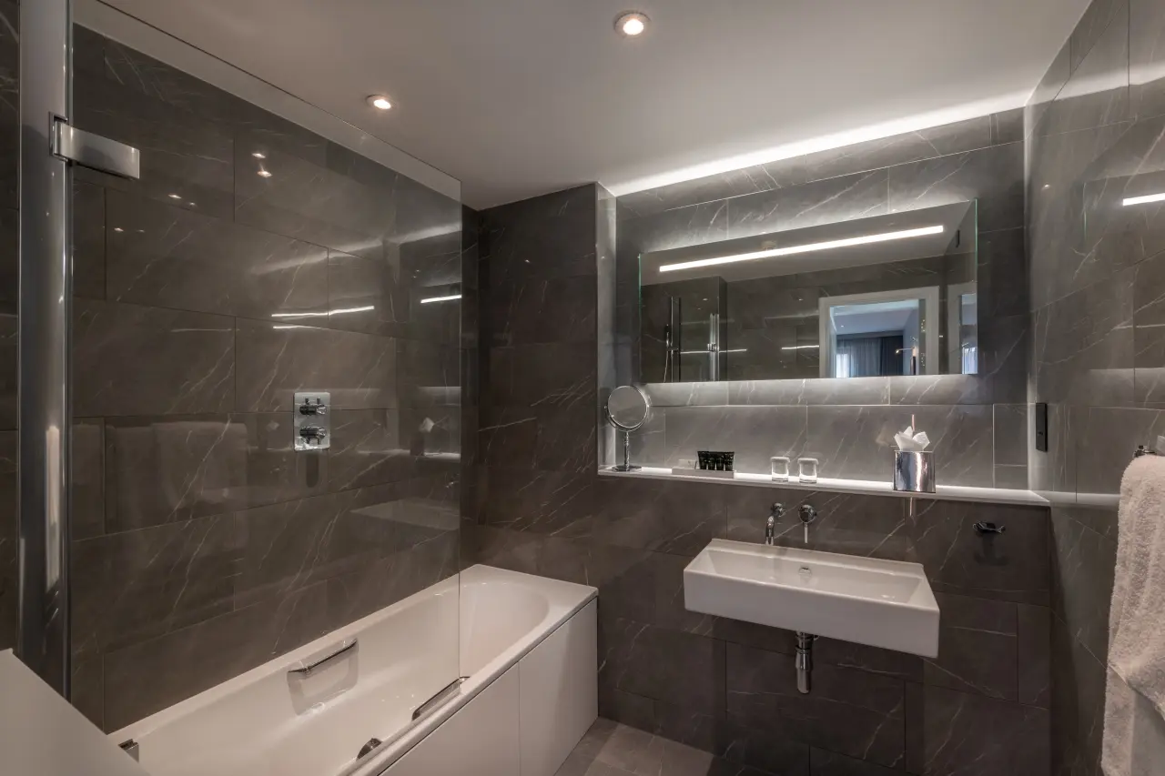 A bathroom with a shower connected to a bath tub.
