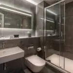 A bathroom with a walk-in shower