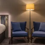 A junior suite with two arm chairs, located in Covent Garden.