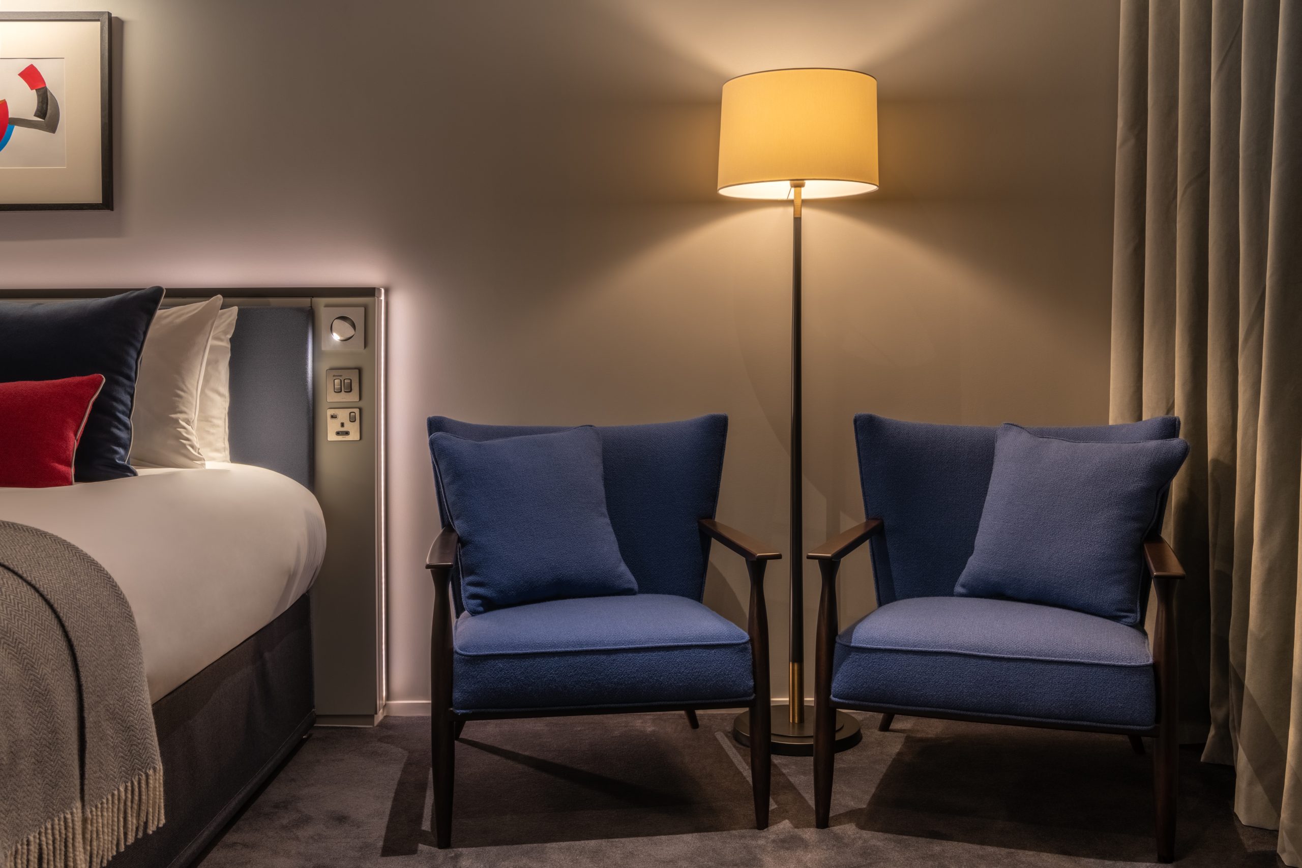 A junior suite with two arm chairs, located in Covent Garden.