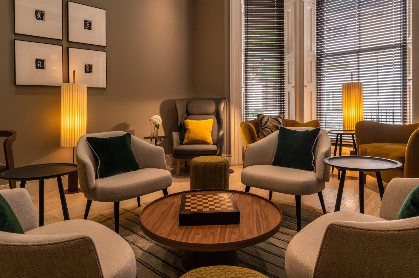 A lounge area with sofas, and a chess board on the coffee table.