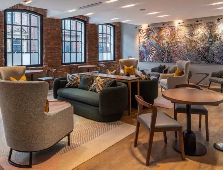 Hotel lounge with multiple seating options and coffee tables.