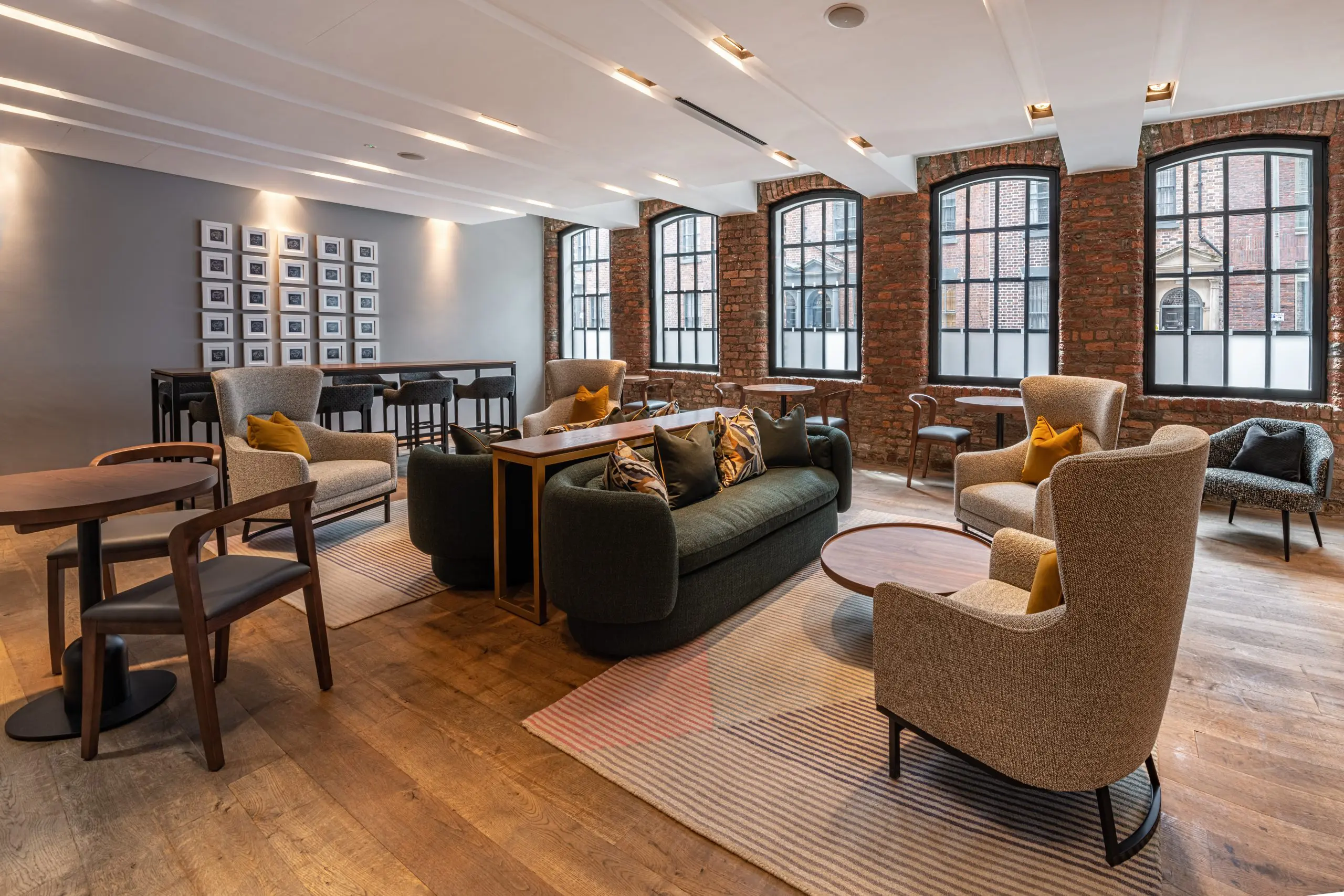 The Resident Liverpool lounge with multiple seating areas and coffee tables.