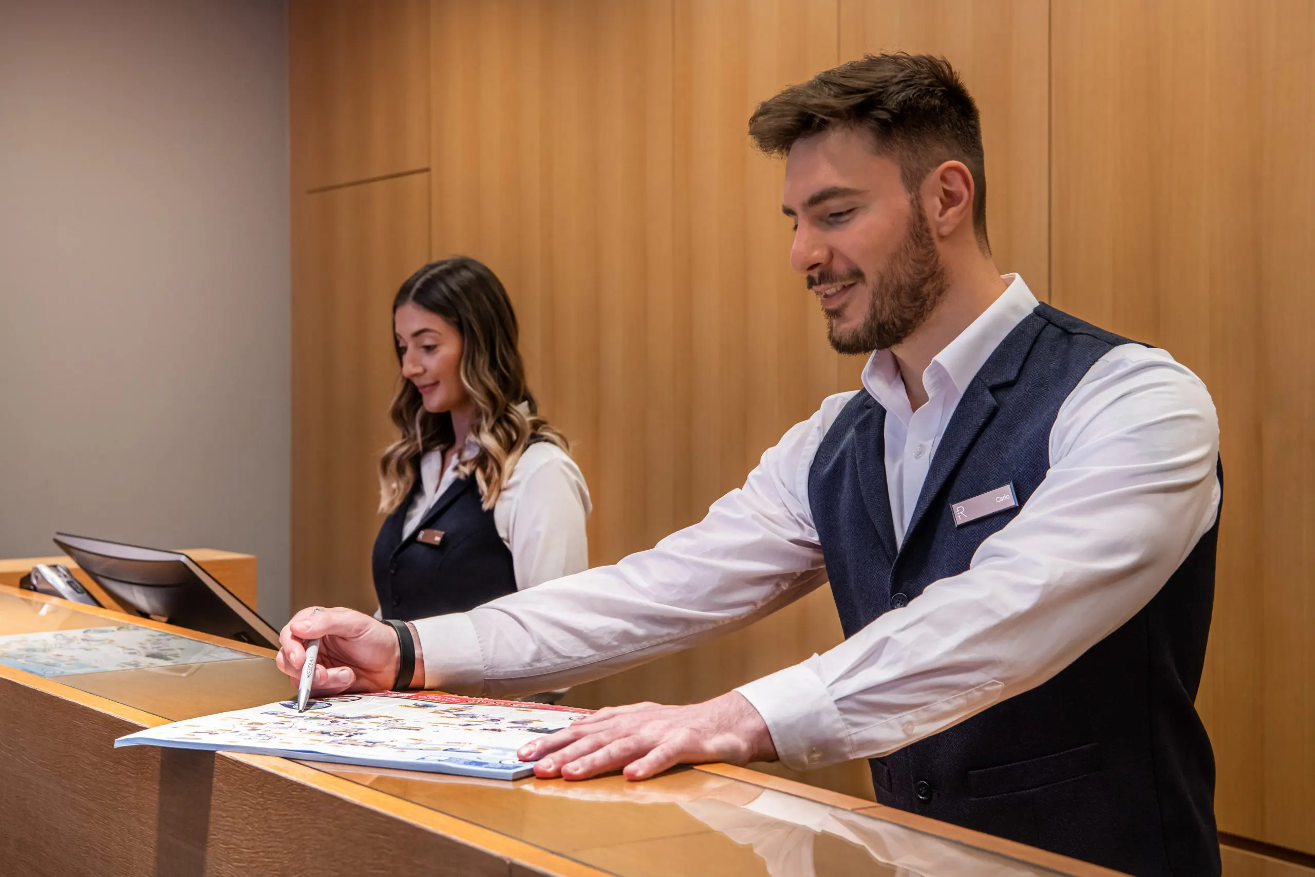 Hotel professionals working at reception in The Resident Liverpool