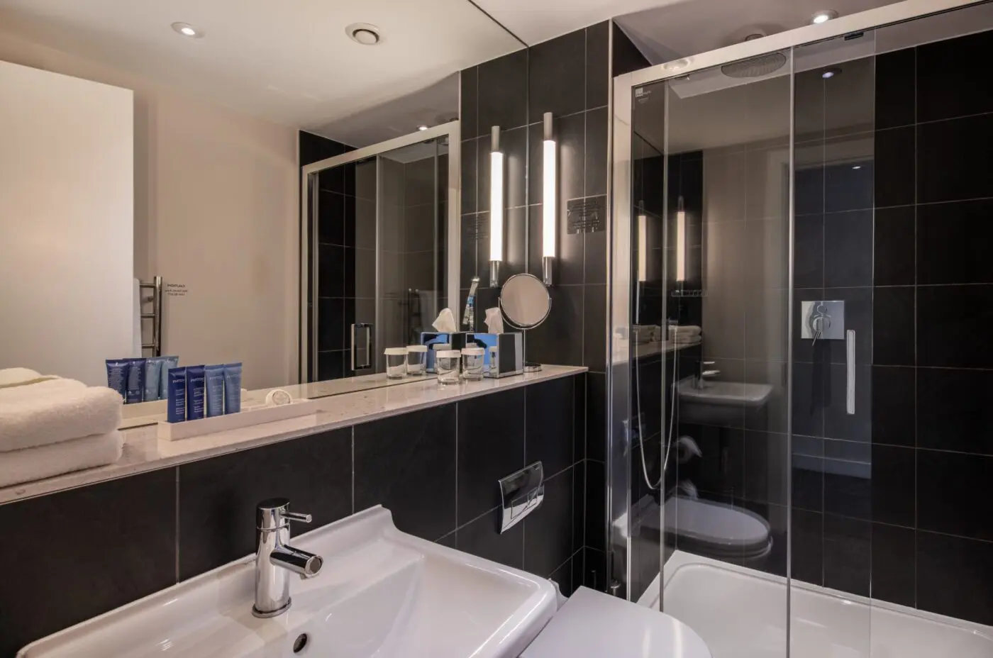 A small bathroom with a walk-in shower.