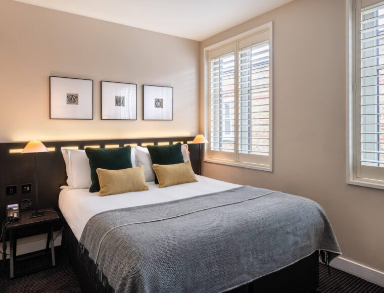 A double bedroom suite, with a double bed and bedside tables.