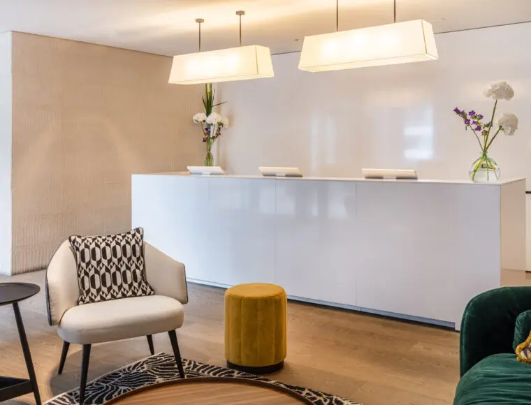 Hotel reception with a separate seating area.