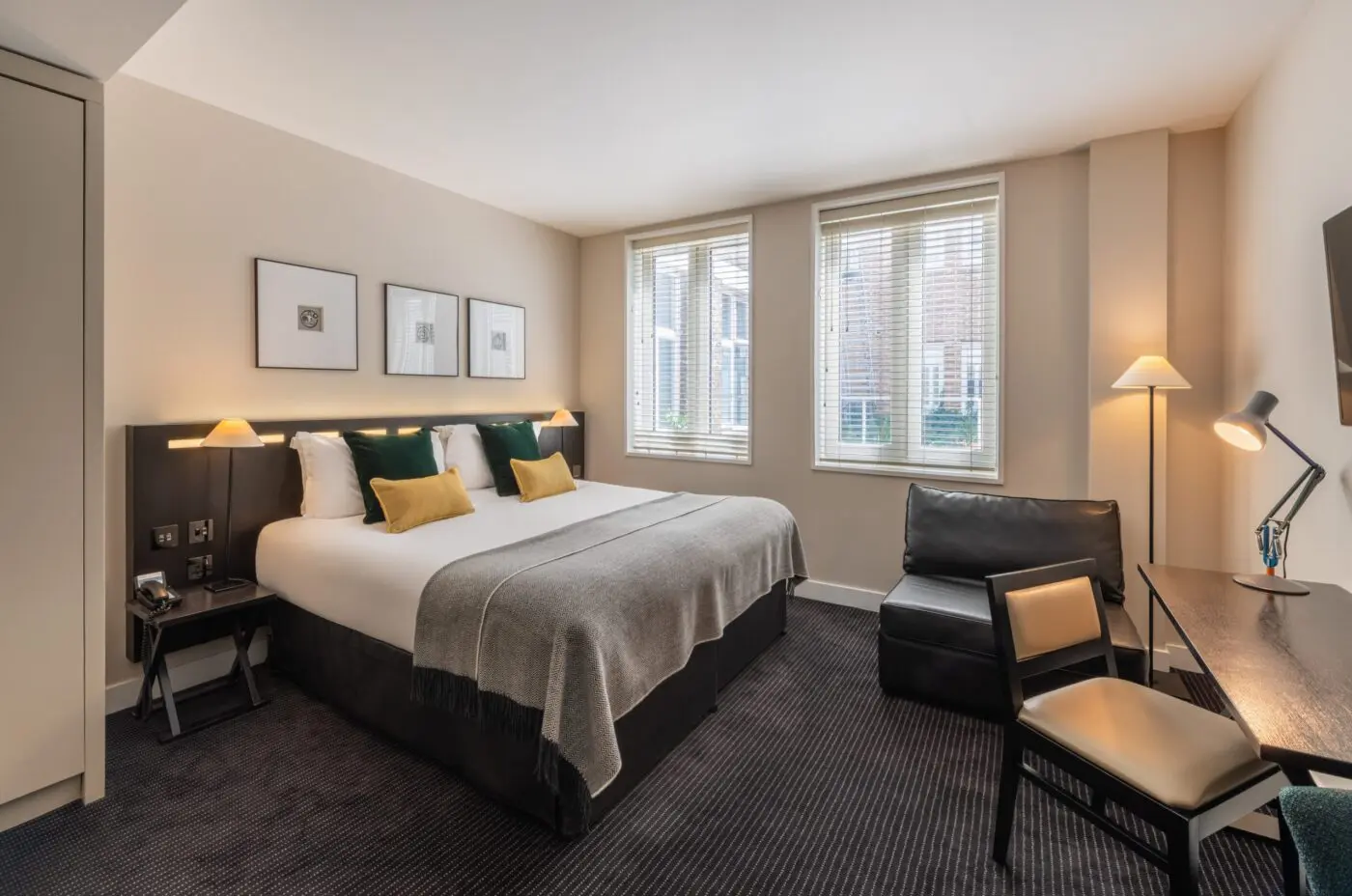 A superior room with a double bed and desk, located in Soho.