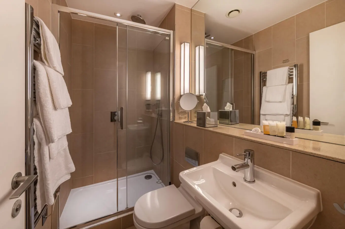 A small bathroom with a walk-in shower, located in Victoria.