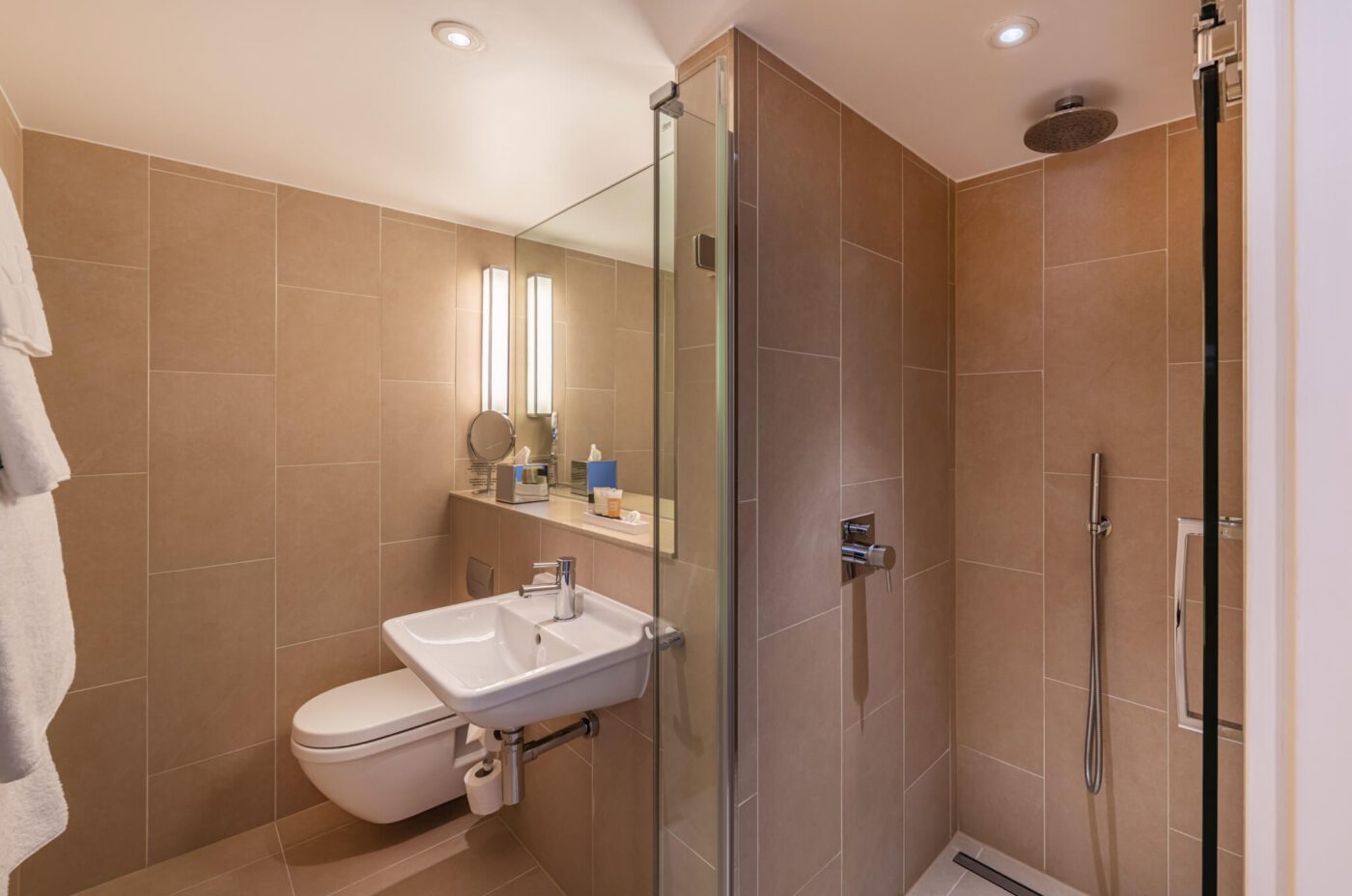 A bathroom with a walk-in shower