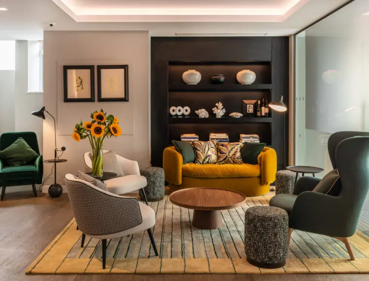 Lounge with sofas, a coffee table and built in shelves.