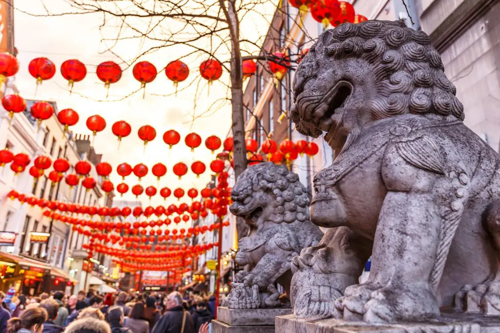 Statues and red lanterns located in Chinatown.