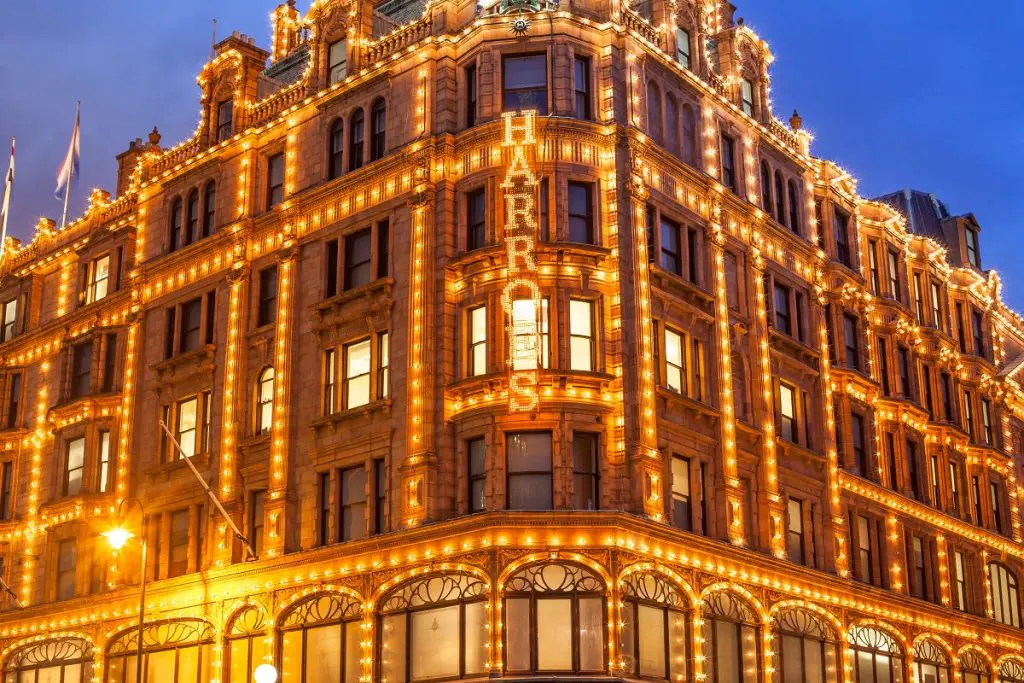 Harrods in the evening, covered in lights.