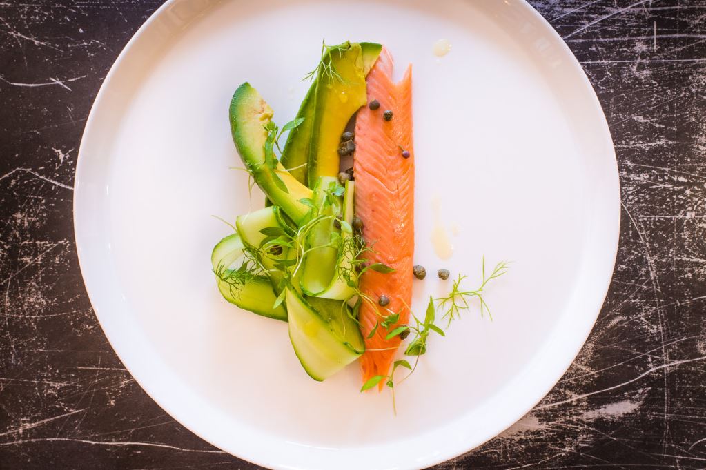 An avocado and salmon dish, served by Aster.