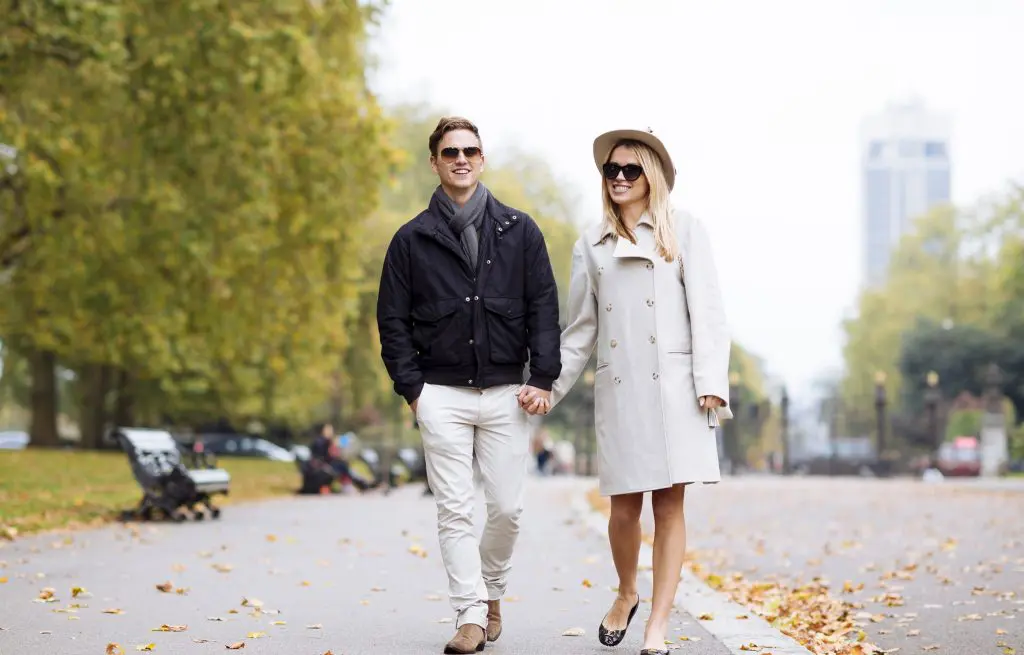 A happy couple walking through Victoria.