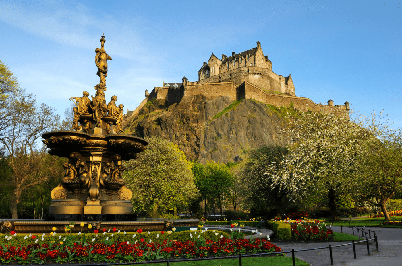 The view of Edinburgh Castle on Castle Rock from the West Prince Street Gardens, with the Ross Fountain