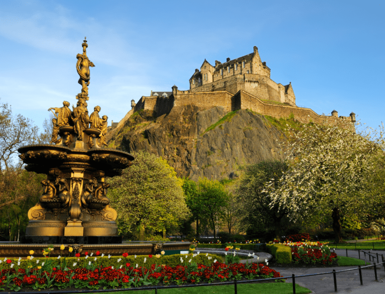 The view of Edinburgh Castle on Castle Rock from the West Prince Street Gardens, with the Ross Fountain