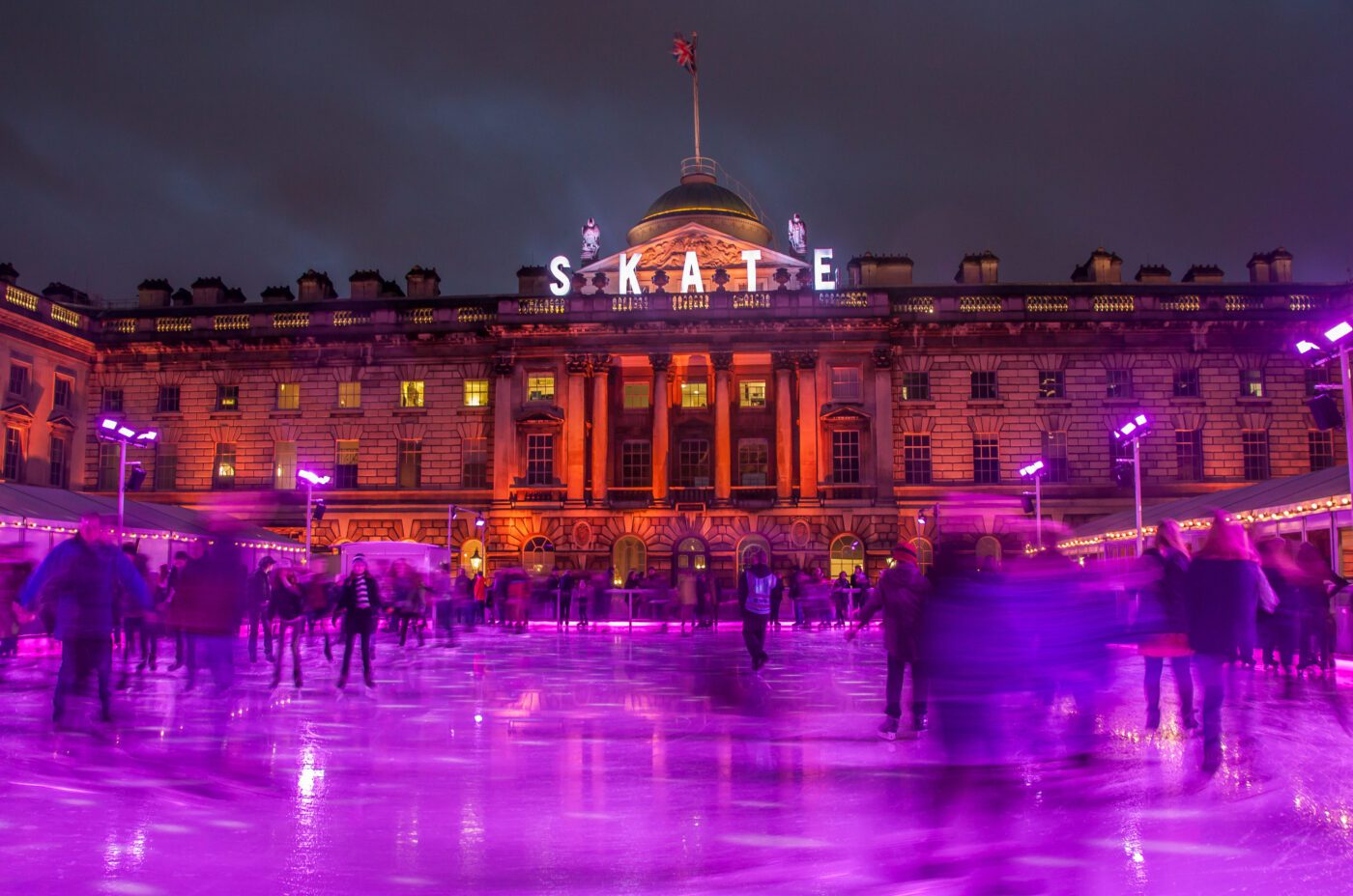 Somerset House's festive ice rink lit in purple for Christmas.