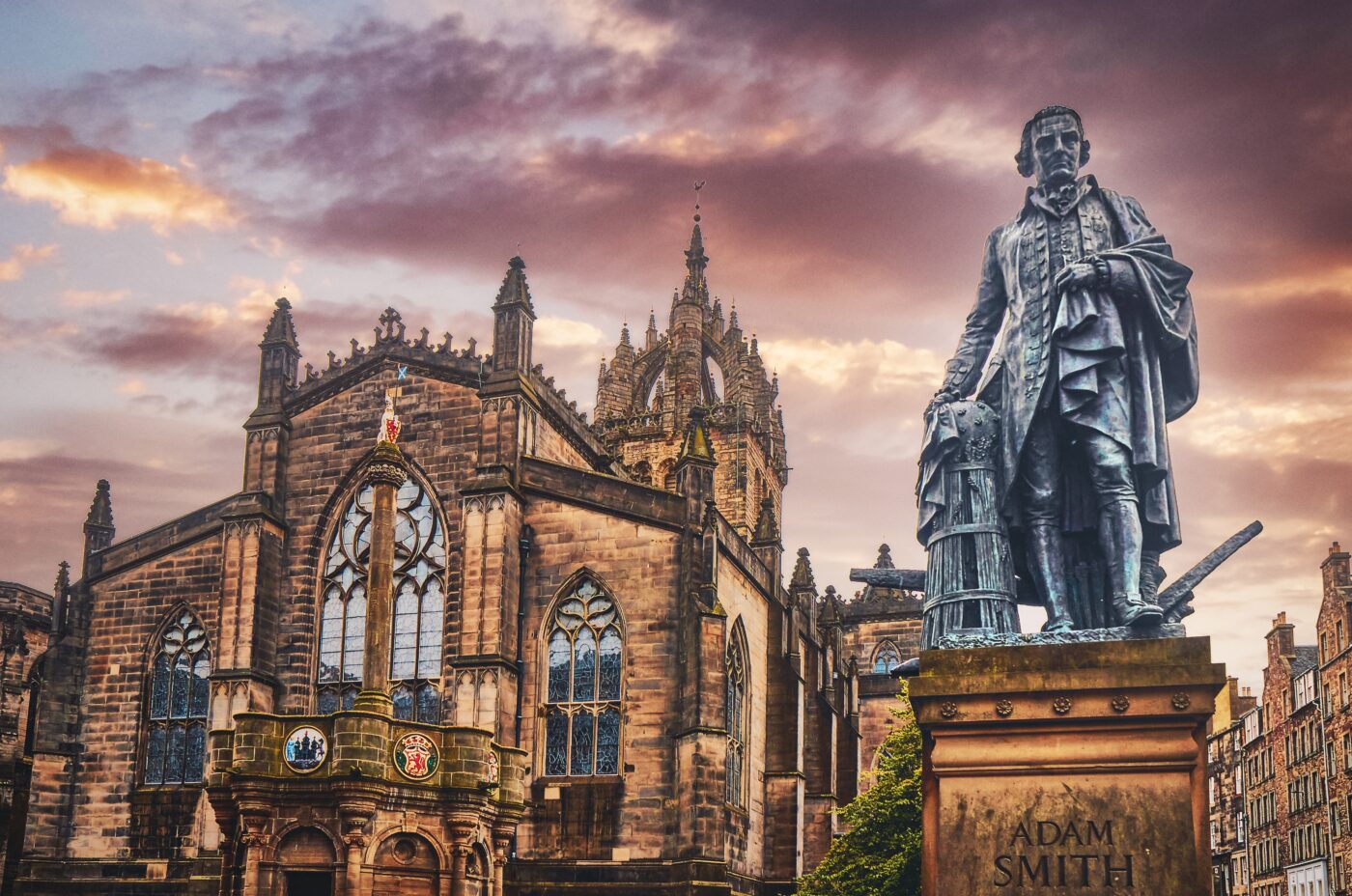 St Giles Cathedral in Edinburgh at sunset, featuring the statue of Adam Smith,
