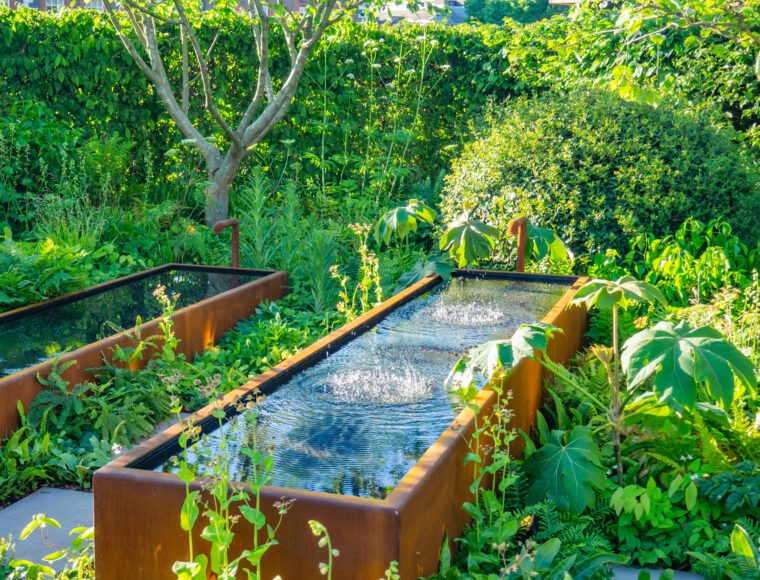Beautifully designed garden with plants and flowers at the RHS Chelsea Flower Show in London