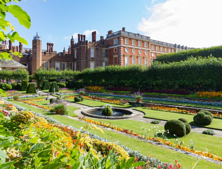 Georgian and Tudor Facades of Hampton Court Palace with the foreground showing the colourful sunken gardens at the RHS Hampton Court Flower Show