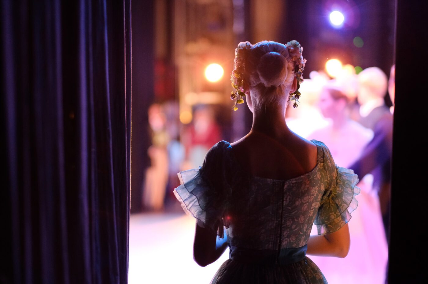 A actress awaiting the moment of entering the stage in the play
