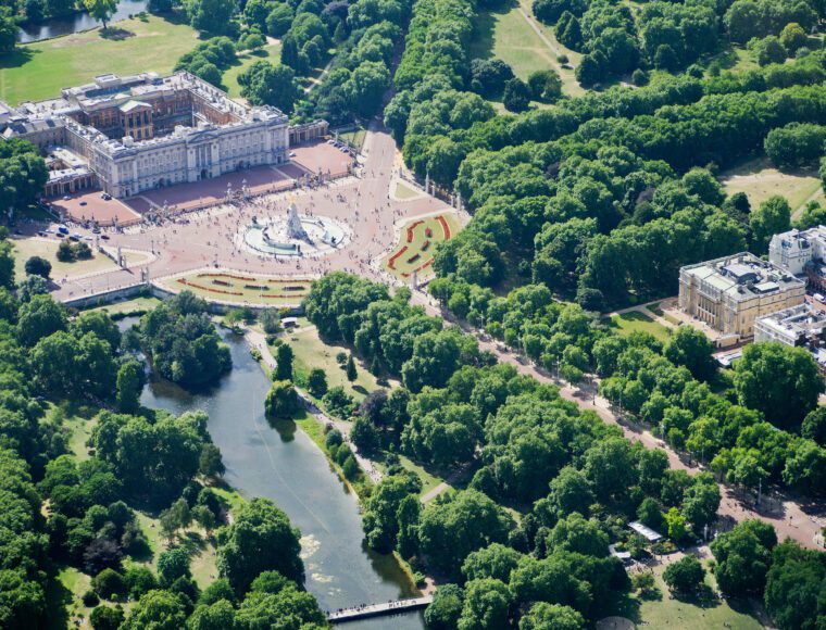 An Aerial View of London Landmarks and Skyline on a Sunny Day Featuring Buckingham Palace, The Mall