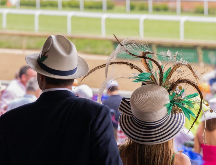 Guests at the Royal Ascot wearing the classic hat and fine clothing.