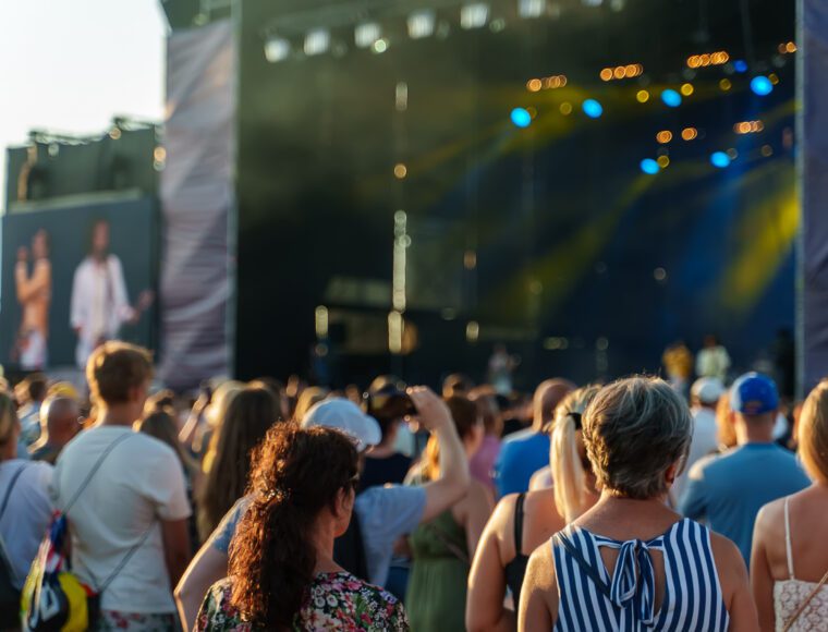 People watching music concert on large stage at BST Hyde Park.