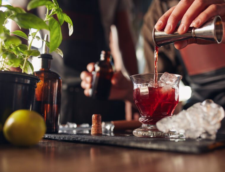 Bartender preparing fresh negroni cocktail during London Cocktail Week
