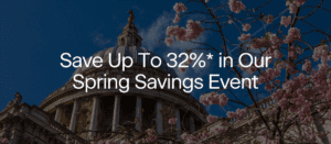 Cherry blossoms frame a domed building under a blue sky, with white text overlaid: "Save Up To 32%* in Our Spring Savings Event.