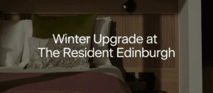A neatly made bed with green and burgundy bedding and a botanical cushion, with the text "Winter Upgrade at The Resident Edinburgh" overlayed in the center.