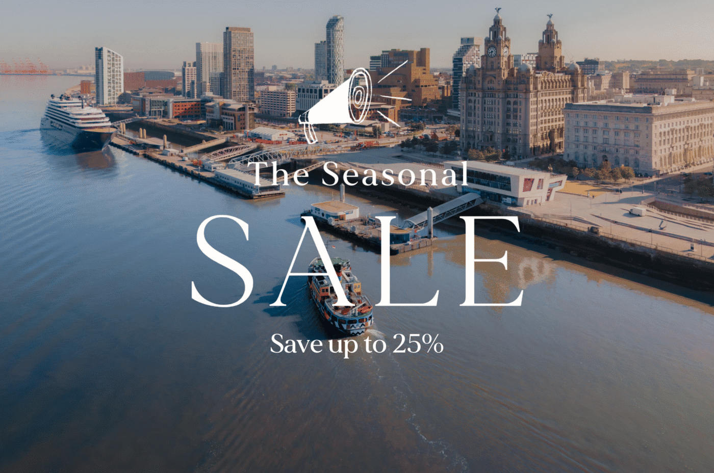 Aerial view of a city waterfront with docked ships and historic buildings. Text overlay reads 